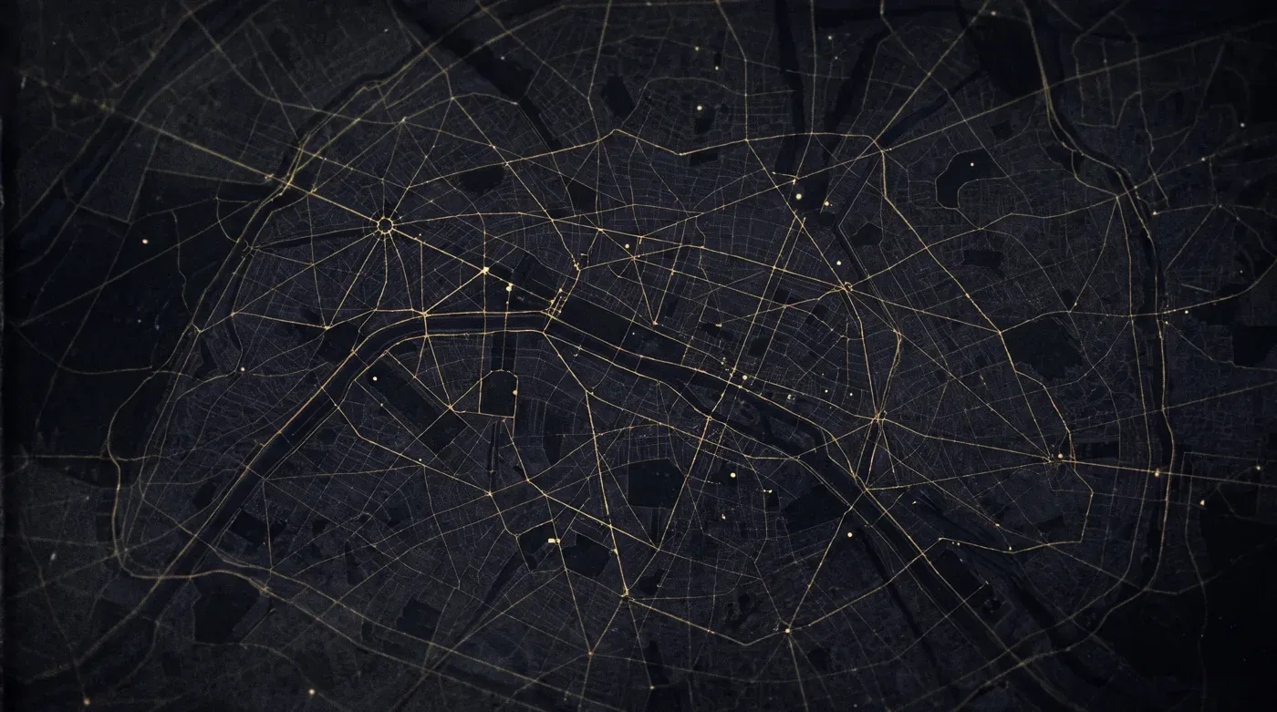 A dark street map of a city seen from above